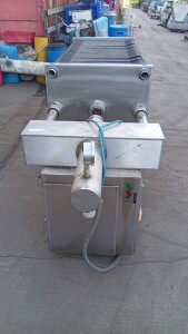 TMCI Padovan filter press – end view with pipe connections and control box